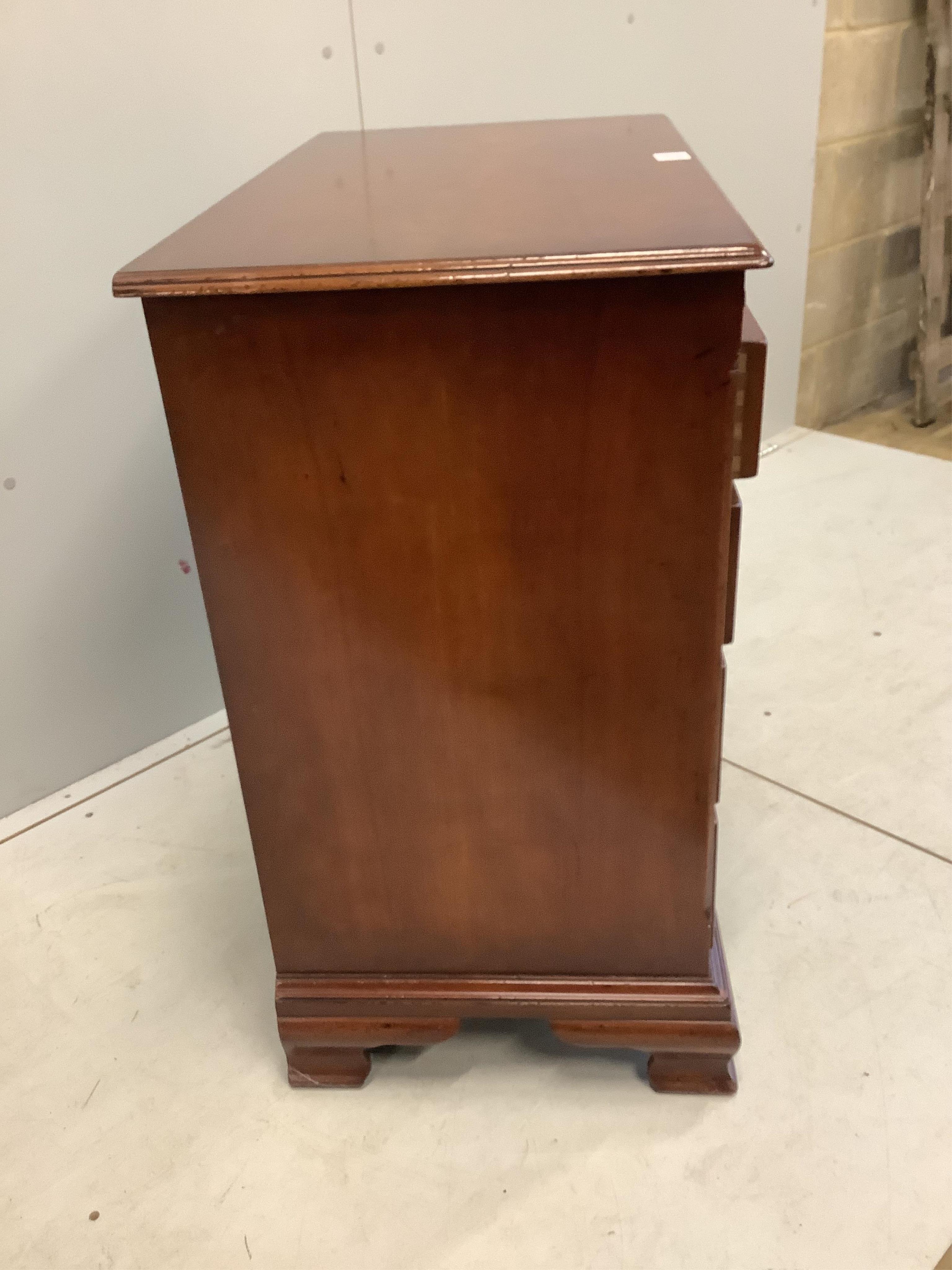 A George III style mahogany chest, fitted four long drawers, beneath a brushing slide, width 84cm, depth 45cm, height 80cm. Condition - good